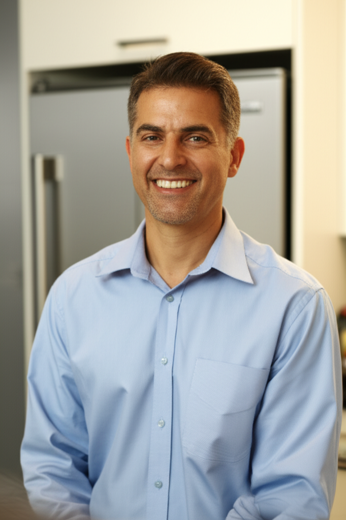 Happy homeowner with repaired luxury appliance